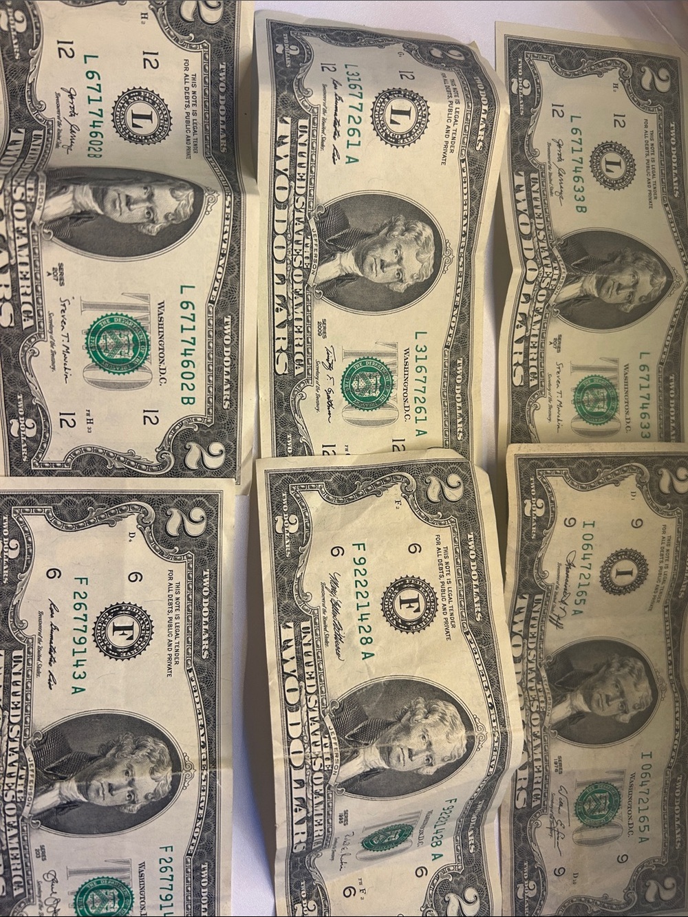 Four US Two-Dollar Bills - Green and Off-White